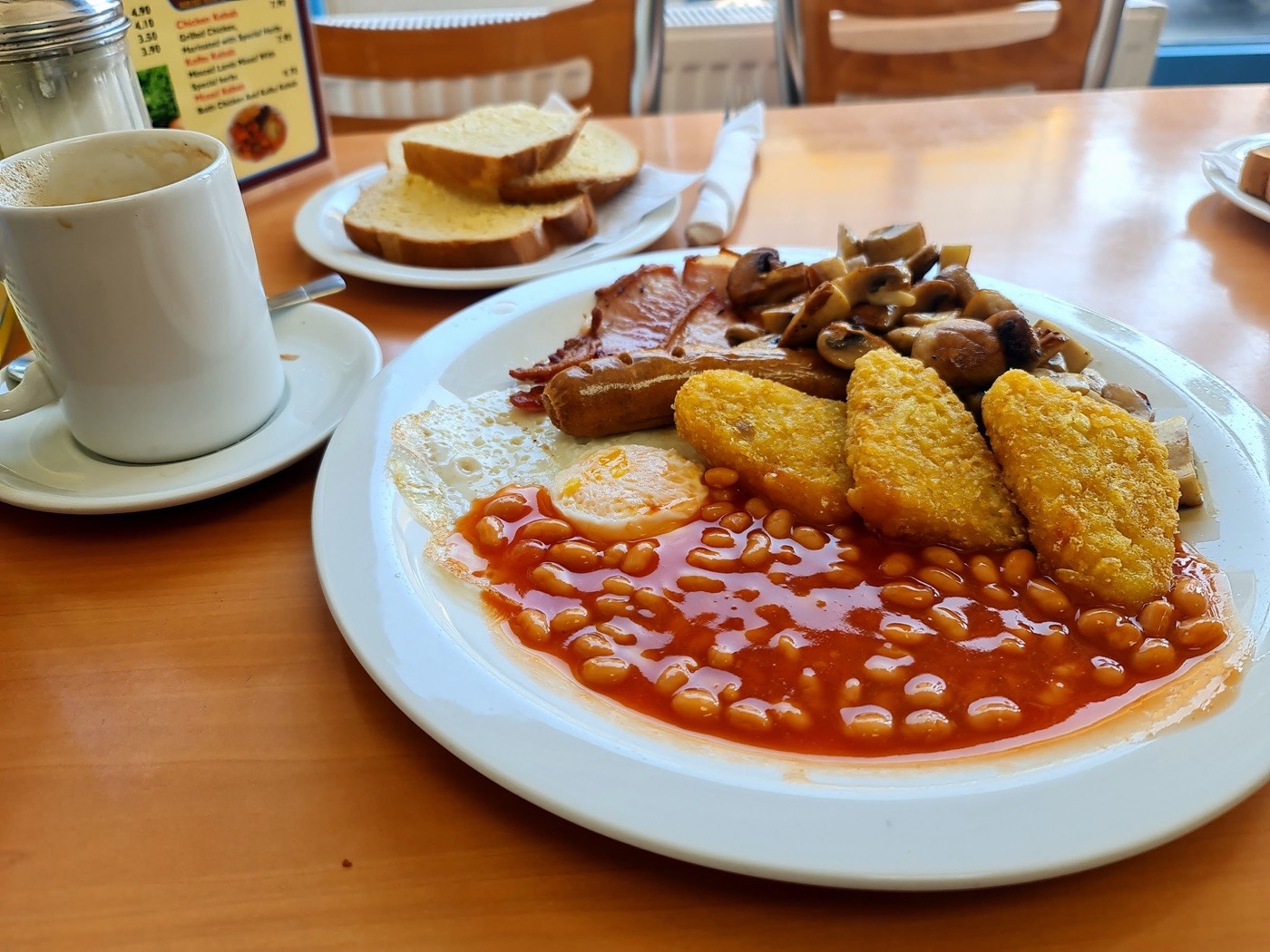 A full English breakfast with a mug of tea and buttered toast at Plaistow Cafe